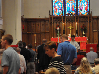 People finding their seats in a church service